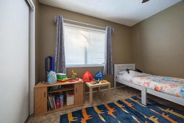 bedroom featuring ceiling fan and carpet floors