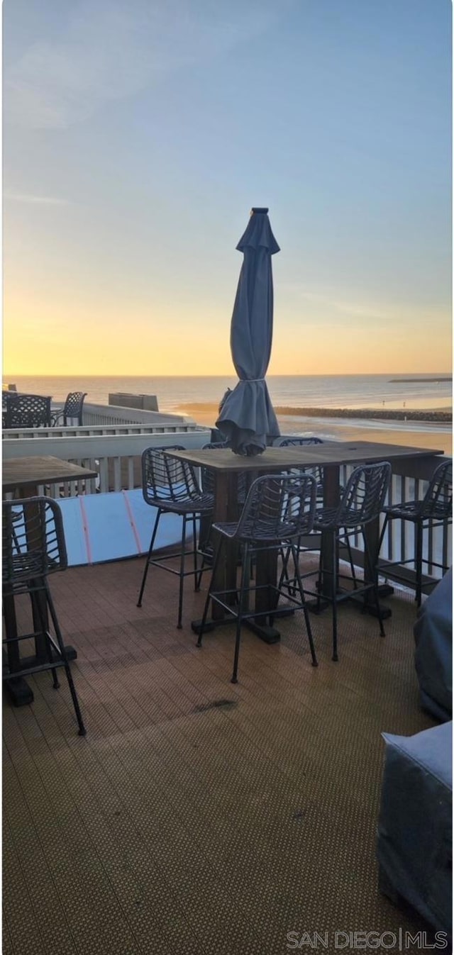 patio terrace at dusk with a water view