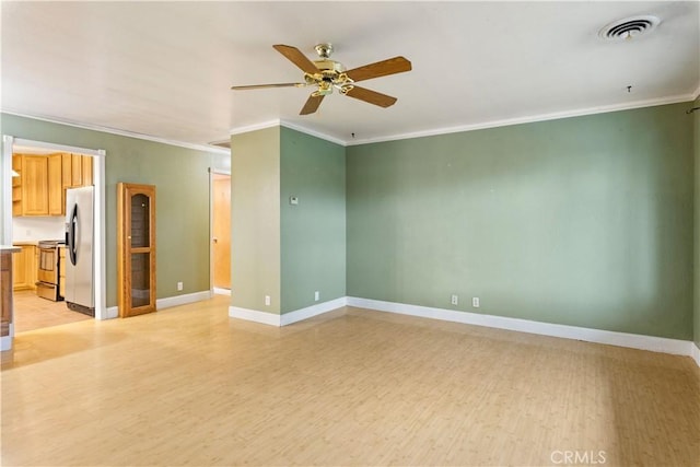 spare room with ceiling fan, ornamental molding, and light hardwood / wood-style floors