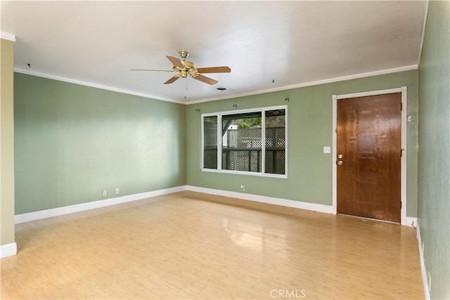 empty room with ceiling fan, light hardwood / wood-style flooring, and ornamental molding