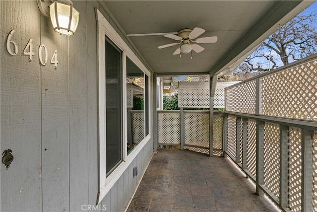 balcony featuring ceiling fan