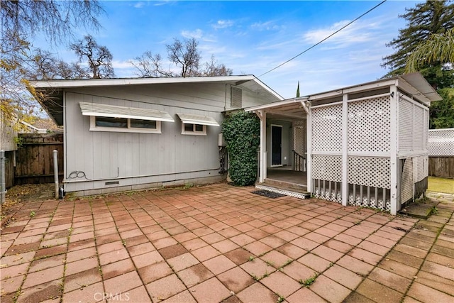 back of property featuring a patio area