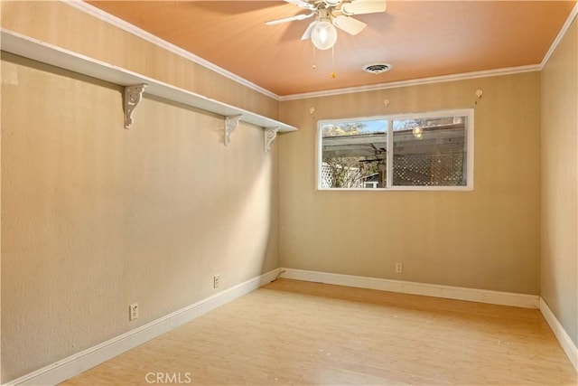 unfurnished room featuring ceiling fan, crown molding, and hardwood / wood-style floors