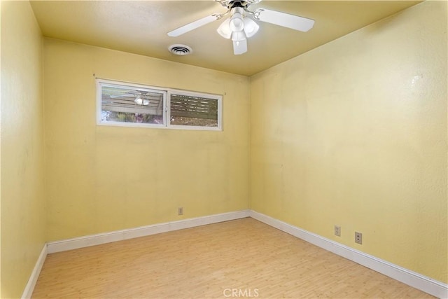 spare room featuring ceiling fan and light hardwood / wood-style floors