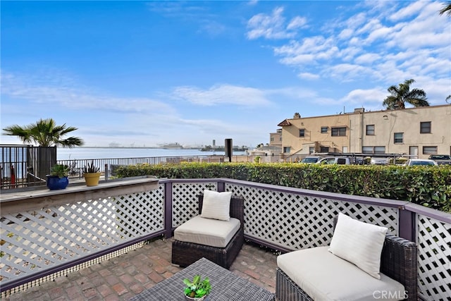 view of patio featuring a water view