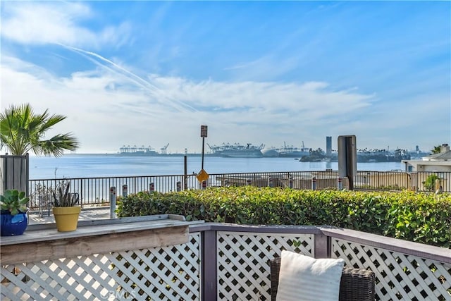 view of patio with a water view