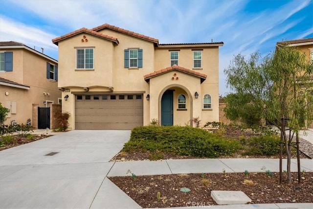 mediterranean / spanish-style house featuring a garage