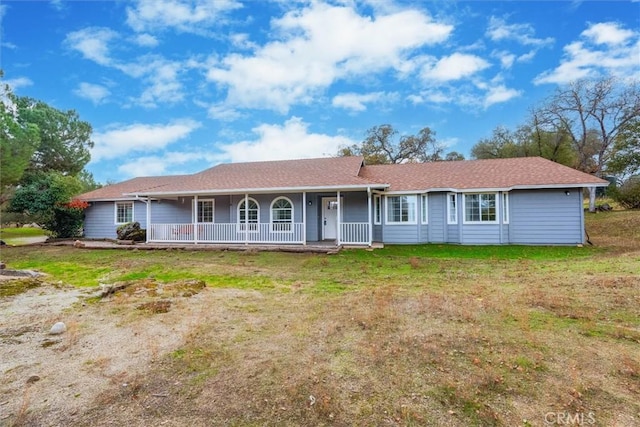 single story home with a front yard and a porch