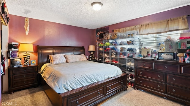 carpeted bedroom with a textured ceiling