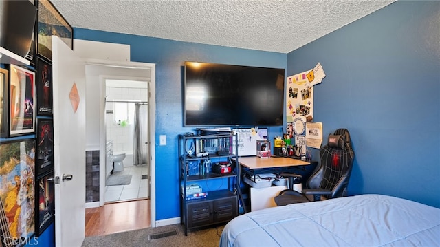 carpeted bedroom with a textured ceiling