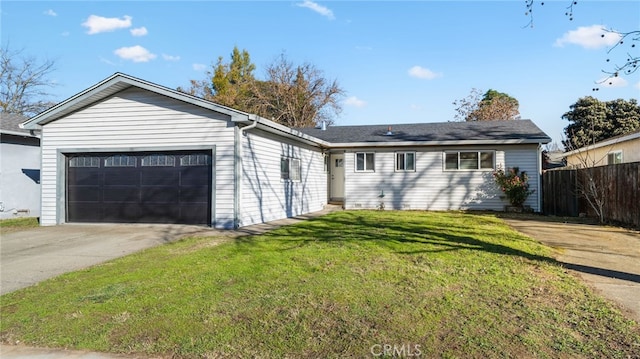 ranch-style home featuring a garage and a front yard