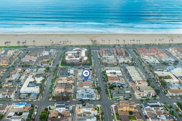 bird's eye view with a beach view and a water view