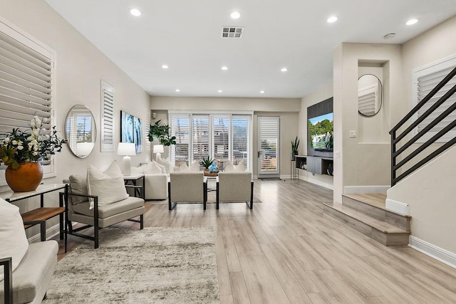 living room with light hardwood / wood-style flooring