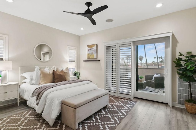 bedroom with ceiling fan, access to outside, and hardwood / wood-style flooring