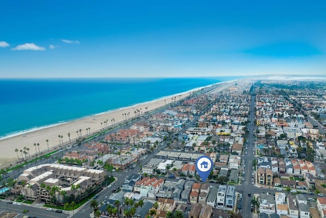 birds eye view of property with a view of the beach and a water view