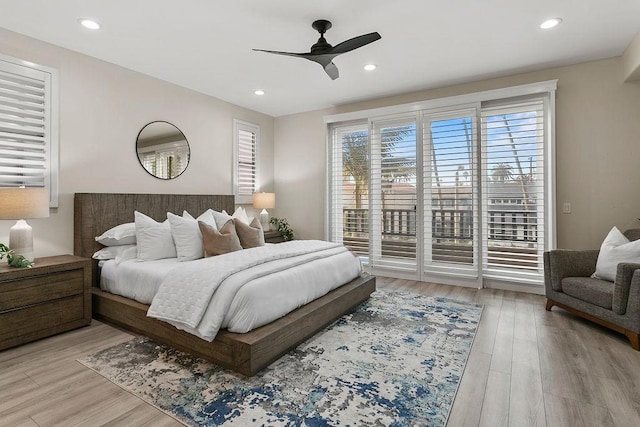 bedroom with ceiling fan, access to exterior, and light hardwood / wood-style flooring