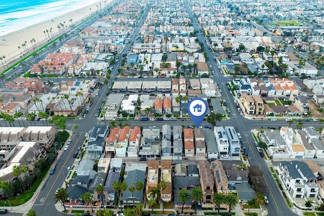 aerial view with a view of the beach and a water view