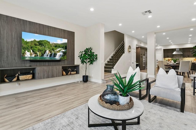 living room with light hardwood / wood-style flooring