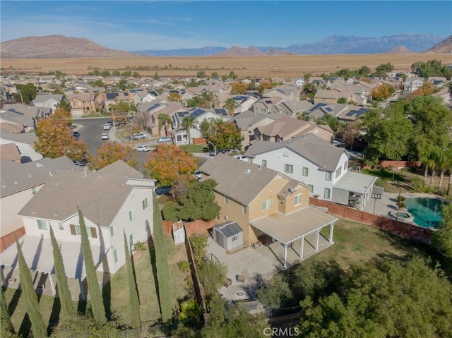 birds eye view of property featuring a mountain view