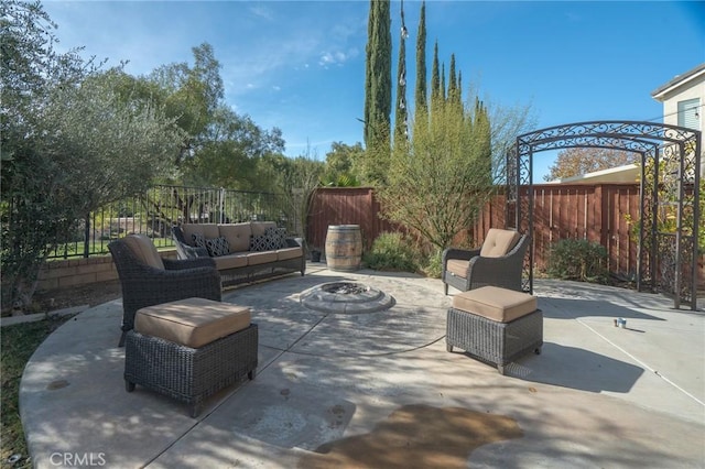 view of patio / terrace with an outdoor living space with a fire pit