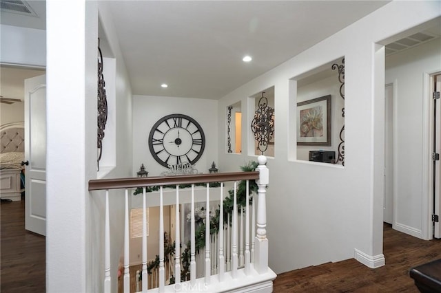 corridor featuring dark hardwood / wood-style flooring