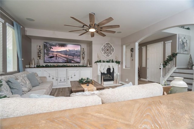 living room featuring hardwood / wood-style flooring and ceiling fan