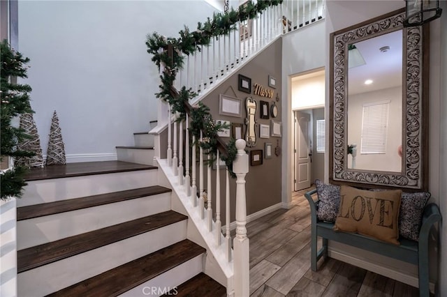 staircase with wood-type flooring