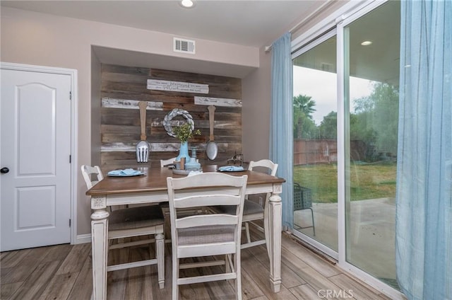 dining area with hardwood / wood-style flooring