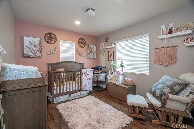 bedroom featuring dark hardwood / wood-style flooring