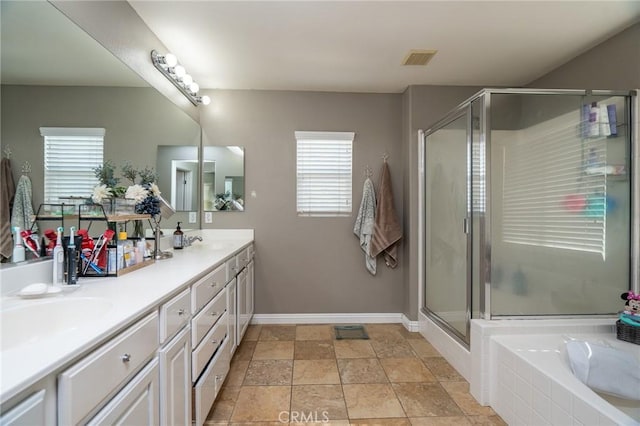 bathroom with vanity and separate shower and tub