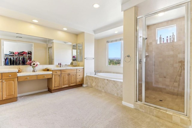 bathroom with vanity and plus walk in shower