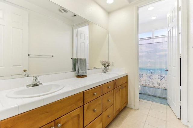 bathroom featuring tile patterned floors and vanity