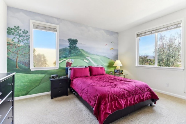 bedroom with carpet and multiple windows