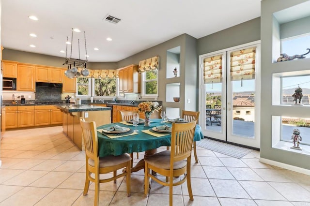 dining area with light tile patterned flooring