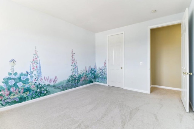 unfurnished bedroom with light colored carpet