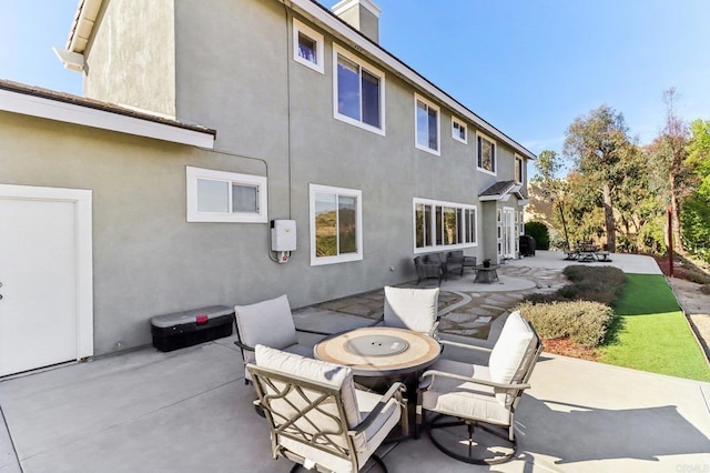 rear view of property featuring a patio