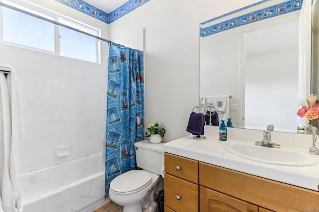 full bathroom featuring toilet, vanity, and shower / bathtub combination with curtain