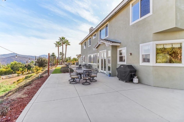 view of patio featuring a mountain view and area for grilling