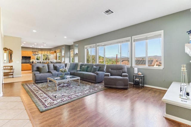 living room with light hardwood / wood-style floors