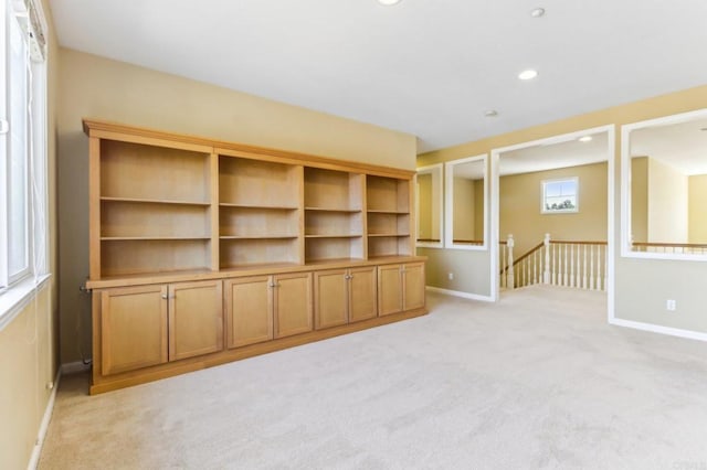 unfurnished living room with light carpet