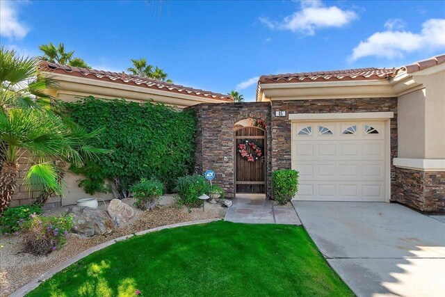 mediterranean / spanish home featuring a garage