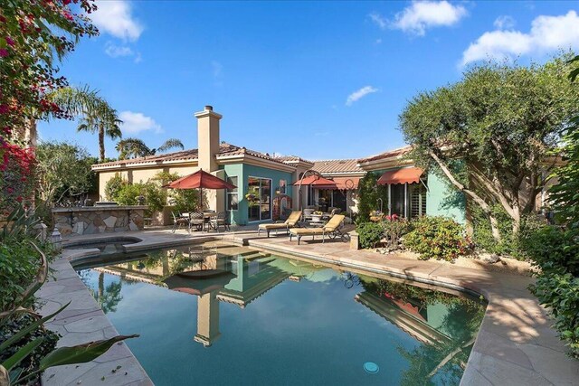 view of pool featuring a patio area