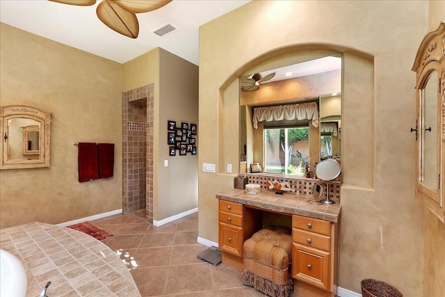 bathroom with ceiling fan, tile patterned floors, and vanity