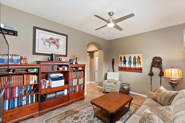 living area featuring light tile patterned flooring and ceiling fan