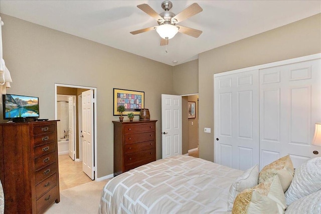 bedroom with light colored carpet, a closet, ceiling fan, and ensuite bathroom