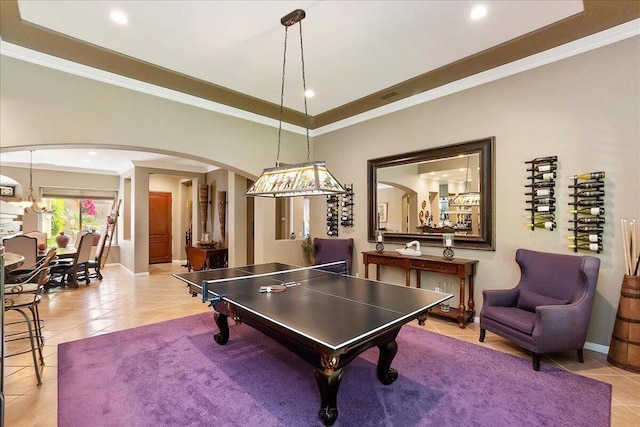 rec room featuring light tile patterned flooring and crown molding