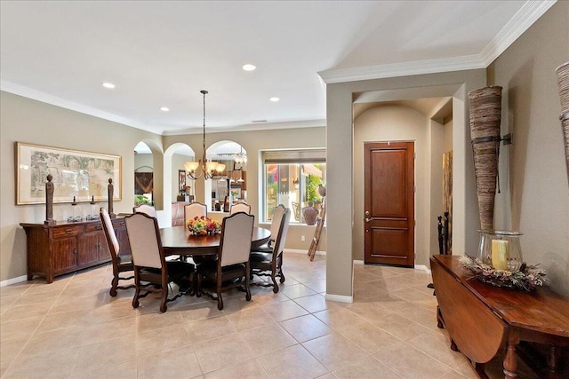 dining room featuring an inviting chandelier, ornamental molding, and light tile patterned floors