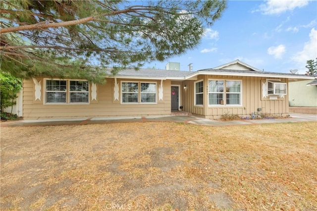 ranch-style house with a front yard