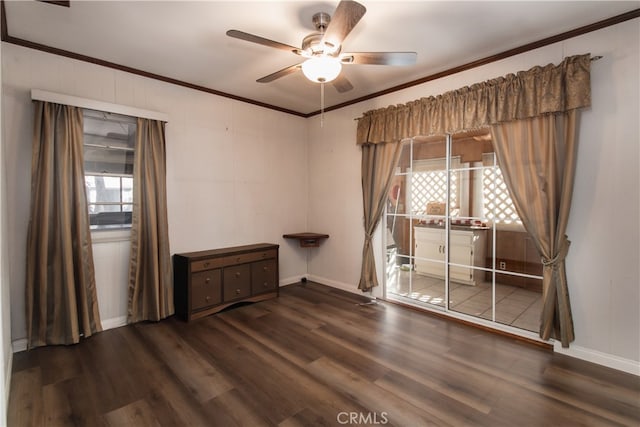 spare room with ceiling fan, dark hardwood / wood-style floors, and ornamental molding