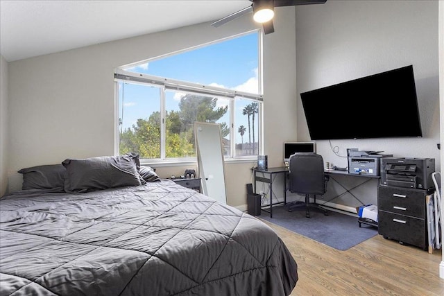 bedroom with hardwood / wood-style flooring and ceiling fan